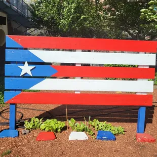 a flag painted on a bench