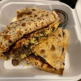 Breakfast Quesadilla with carne asada, scrambled eggs, and hatch green chiles! Juicy tender steak! My favorite so far!
