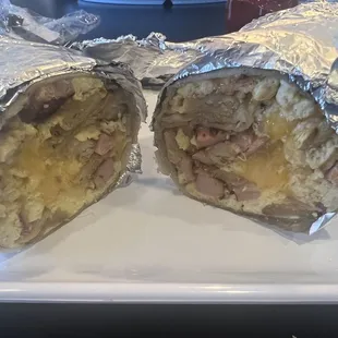 Breakfast burrito with scrambled egg, diced potatoes, cheddar cheese with ham.