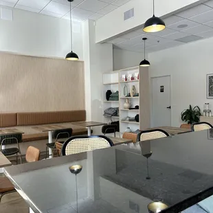 Inside seating area with plenty of seating and outlets on the long bar seats