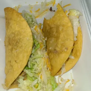 two tortillas in a styrofoam container