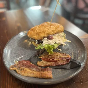 Chicken Croissant sandwich with a rasher of peppered bacon