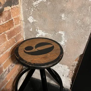 a stool with a smiley face painted on it