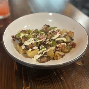 Burnt pastrami ends hash with salsa verde and horseradish crème
