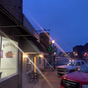 a red truck parked in front of a restaurant