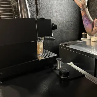 a bari bari serving a cup of coffee