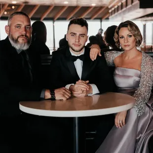 Before the wedding, Kaleb and his parents were waiting in the bar area.