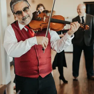 The violinist played while we ate along with the guitarist.