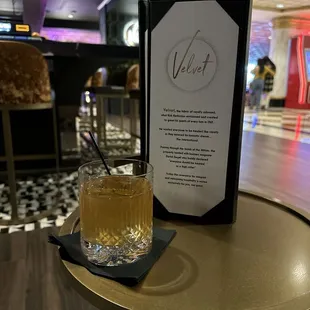 A Big Jimmy cocktail next to the menu