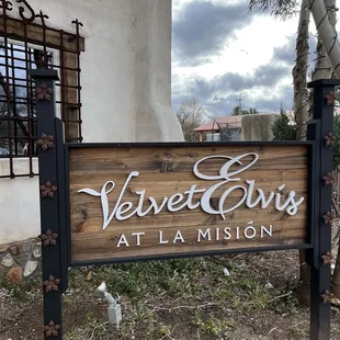 a sign in front of a building