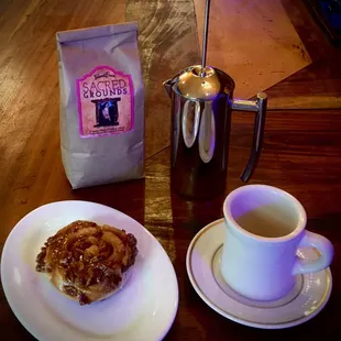 a plate of food and a cup of coffee