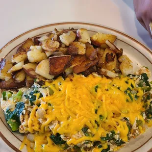 Veggie omelet with cheddar cheese and country potatoes