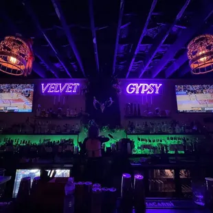 a man standing in front of a bar