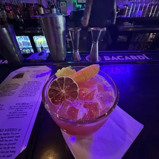 a cocktail with grapefruit and orange slices