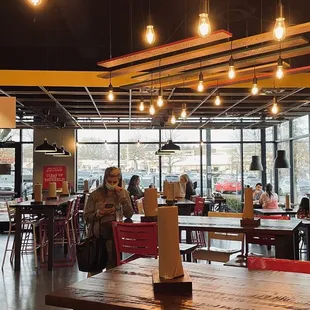 people sitting at tables in a restaurant