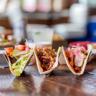 a variety of tacos on a table