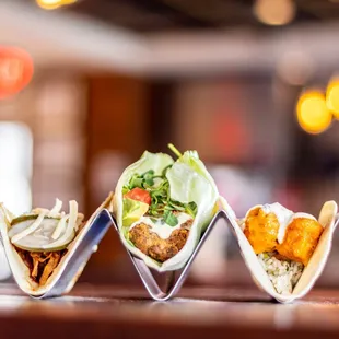 a variety of tacos on a table