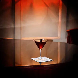 a glass of wine on a table