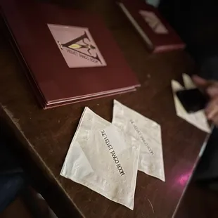 a person sitting at a table with papers on it