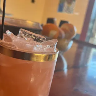 a cocktail in a glass with a straw