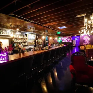 a bar with neon signs