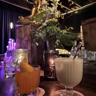 two cocktails on a bar