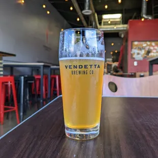 a glass of beer on a table