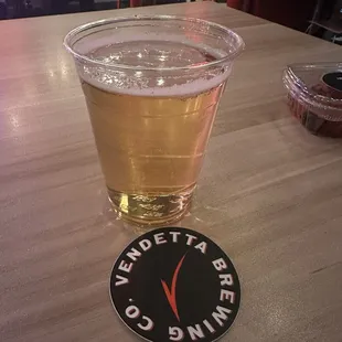 a pint of beer on a table