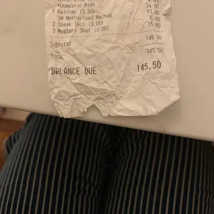 a receipt on a refrigerator door