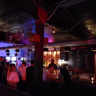 a group of people at a bar