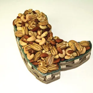 a heart shaped basket of nuts