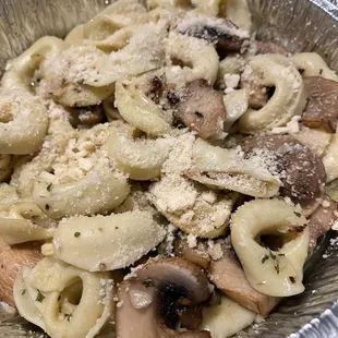 Cheese tortellini with mushrooms garlic and oil