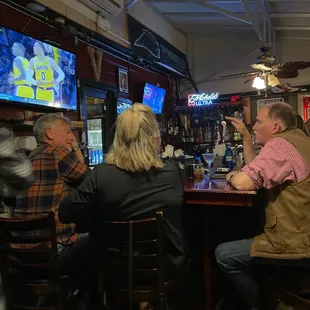 people sitting at the bar