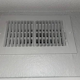 Gray paint over every inch of the apartment, even air vents
