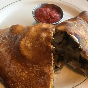 Sausage, mushroom, and jalapeno calzone.