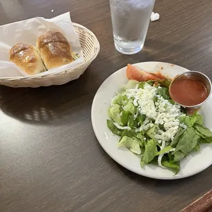 Salad, bread, and marinara sauce