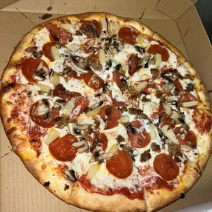 Pepperoni, pineapple, mushroom pizza. Size in photo is large!
