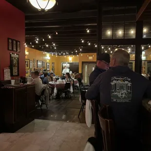 a group of people sitting at tables