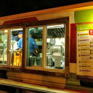 a man ordering food from a food truck