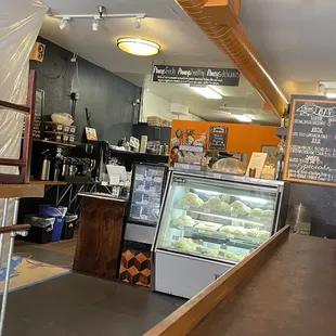 a bakery with a counter and shelves