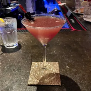Bartenders yummy creation.  Muddled black cherries, fresh lime,  simple syrup &amp; Tittos.
