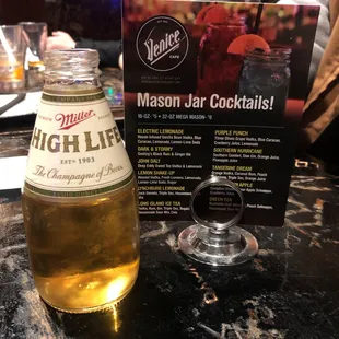 a glass of beer and menu