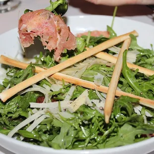 The Carpaccio &amp; Polenta was made with thinly sliced filet mignon, arugula, crispy capers, polenta, parmesan cheese, aioli, and white truffle