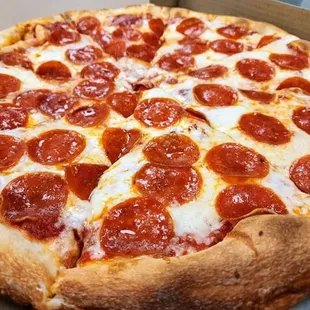 a pepperoni pizza in a box