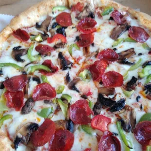 Large pizza with pepperoni, mushrooms and green/red peppers. So good.