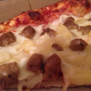 Cheese pizza with sausages &amp; pineapples.Tastes like regular pizza you get from a regular o'l place.Nothing special but not bad.