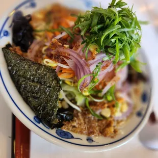 a bowl of ramen and vegetables