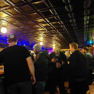 a group of people at a bar