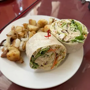 Breakfast chicken wrap with a side of home fries