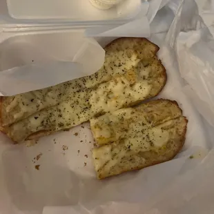 two pieces of bread in a plastic container